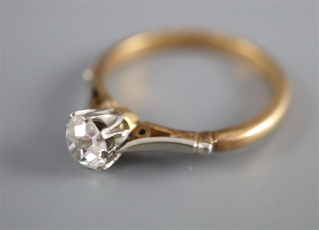 An 18ct gold and platinum, solitaire diamond ring,